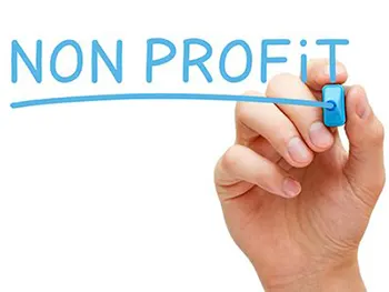 hand writing non-profit on glass