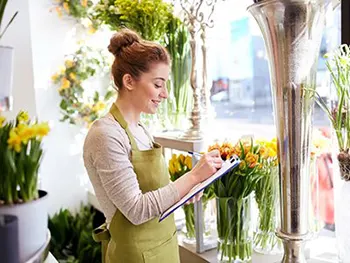 woman writing on note pad